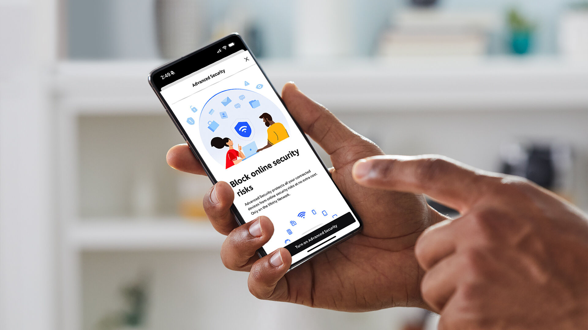 A person holding a phone that is displaying the Xfinity Advanced Security app