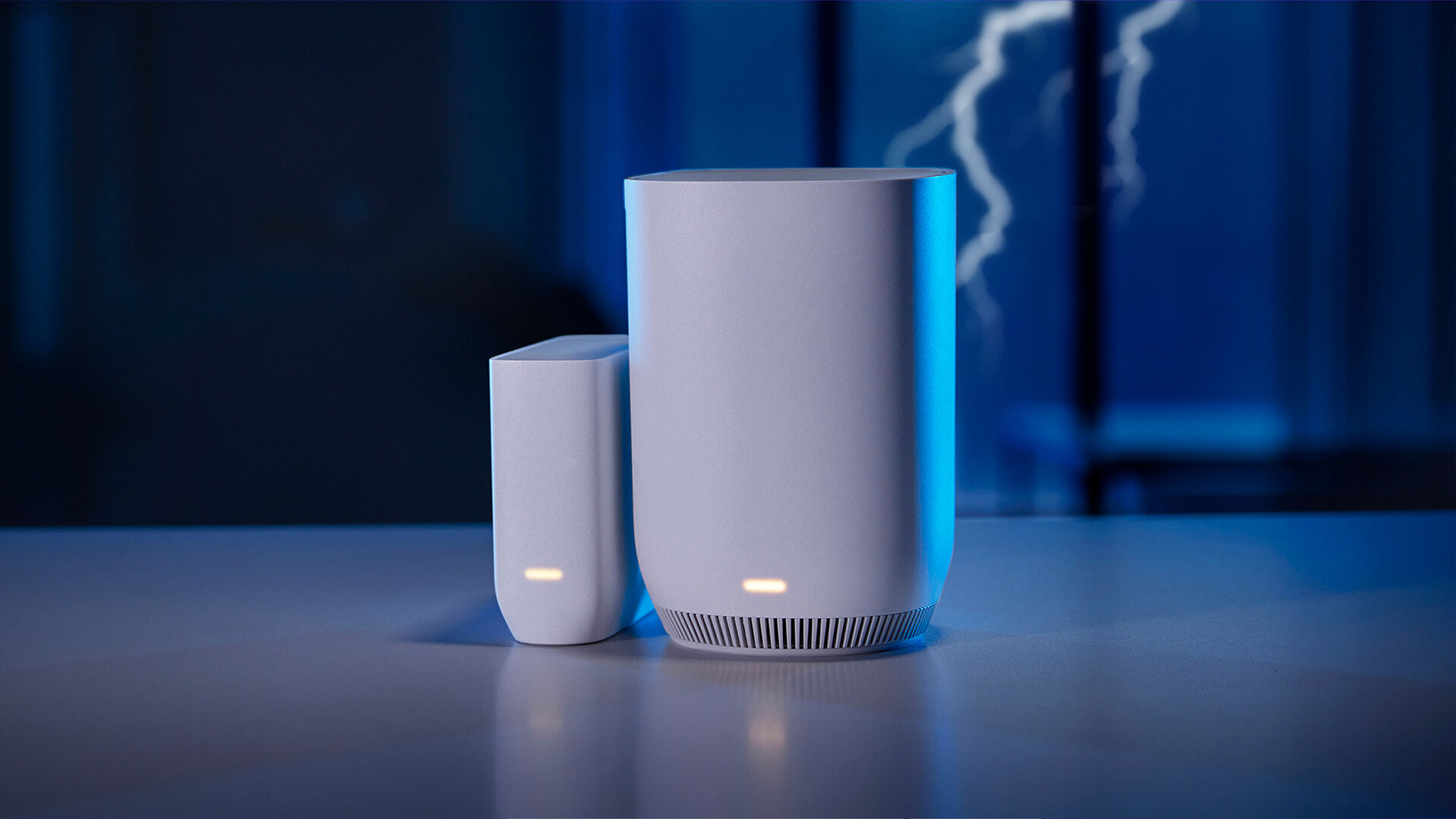 A set of xFi Pro WiFi Extenders sitting on a counter