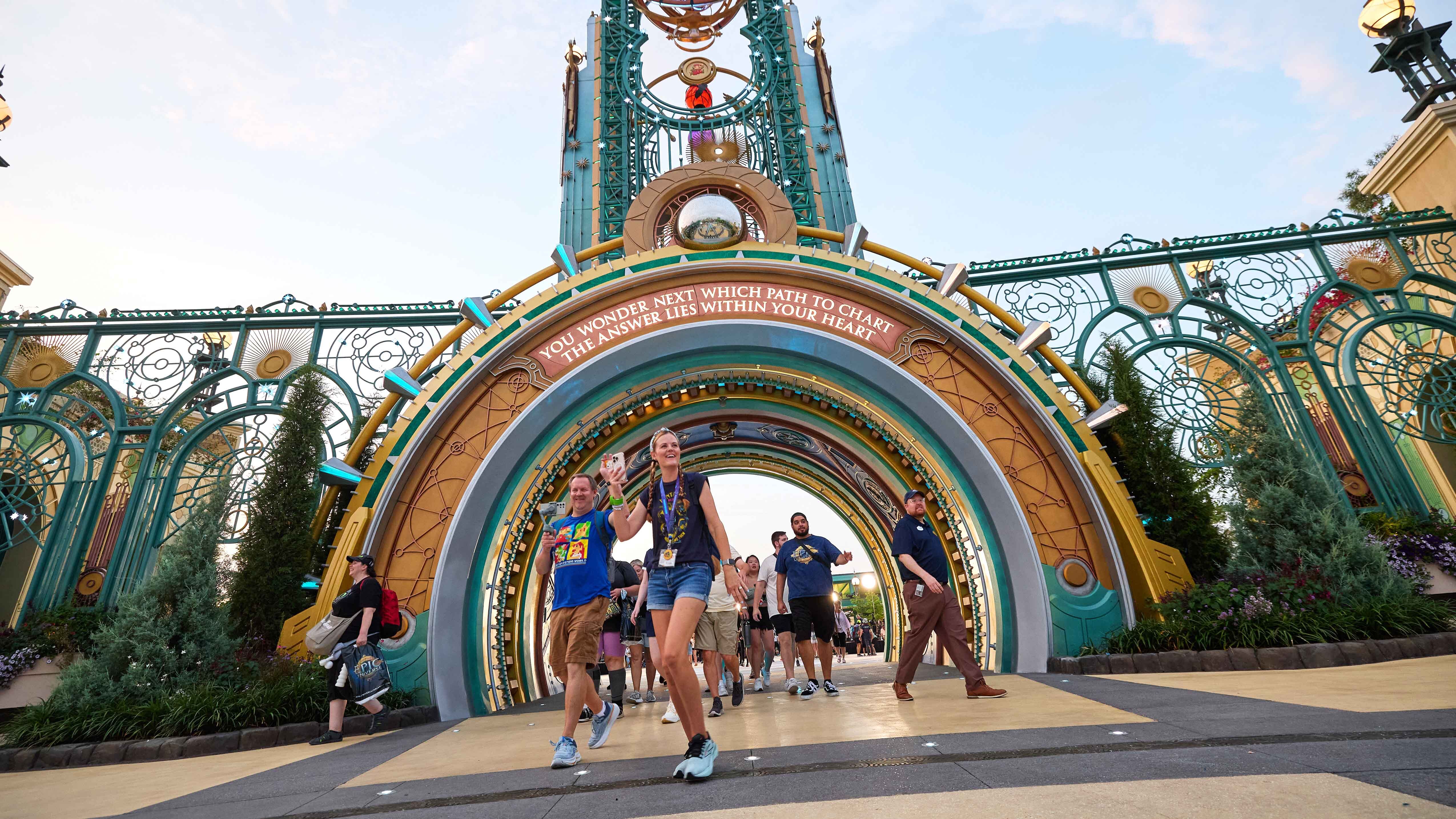 Patrons walking through the entrance of Universal Epic Universe