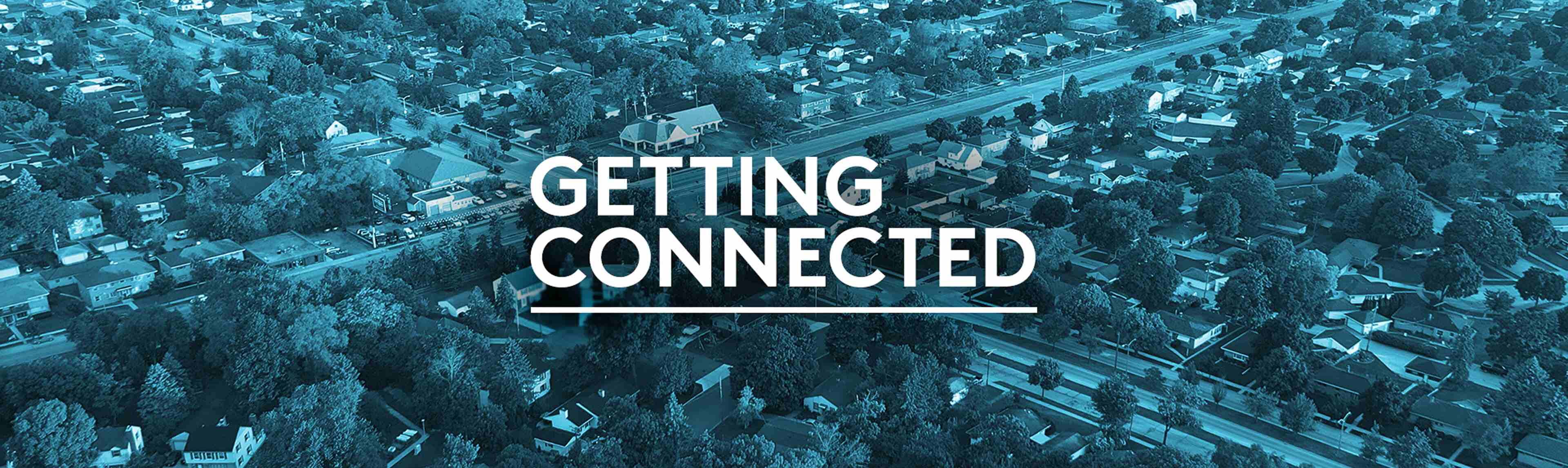 Aerial view of a suburban neighborhood with “Getting Connected” written over the image