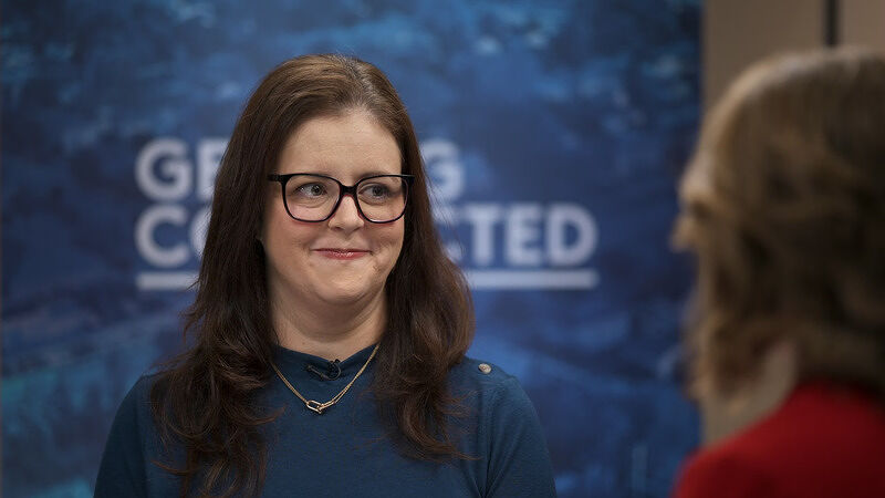 Megan Steckly during her interview with a blue backdrop