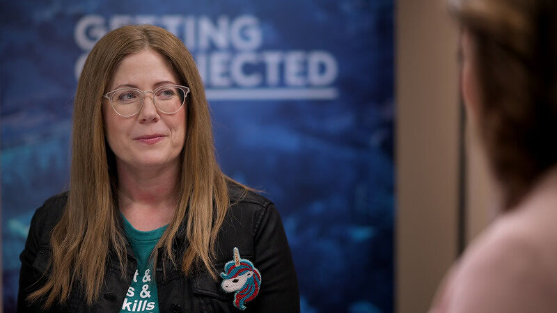Angela Siefer in the interview setting with a 'Getting Connected' backdrop