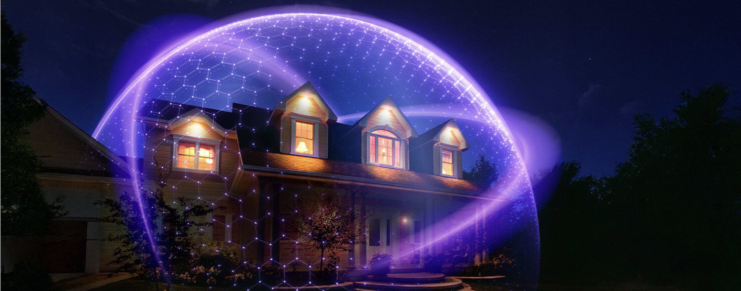 A nighttime view of a large house with lit windows surrounded by a glowing blue‑purple protective dome